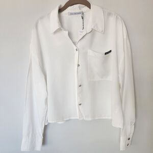 Calvin Klein Jeans long sleeve white button down crop top, size Medium